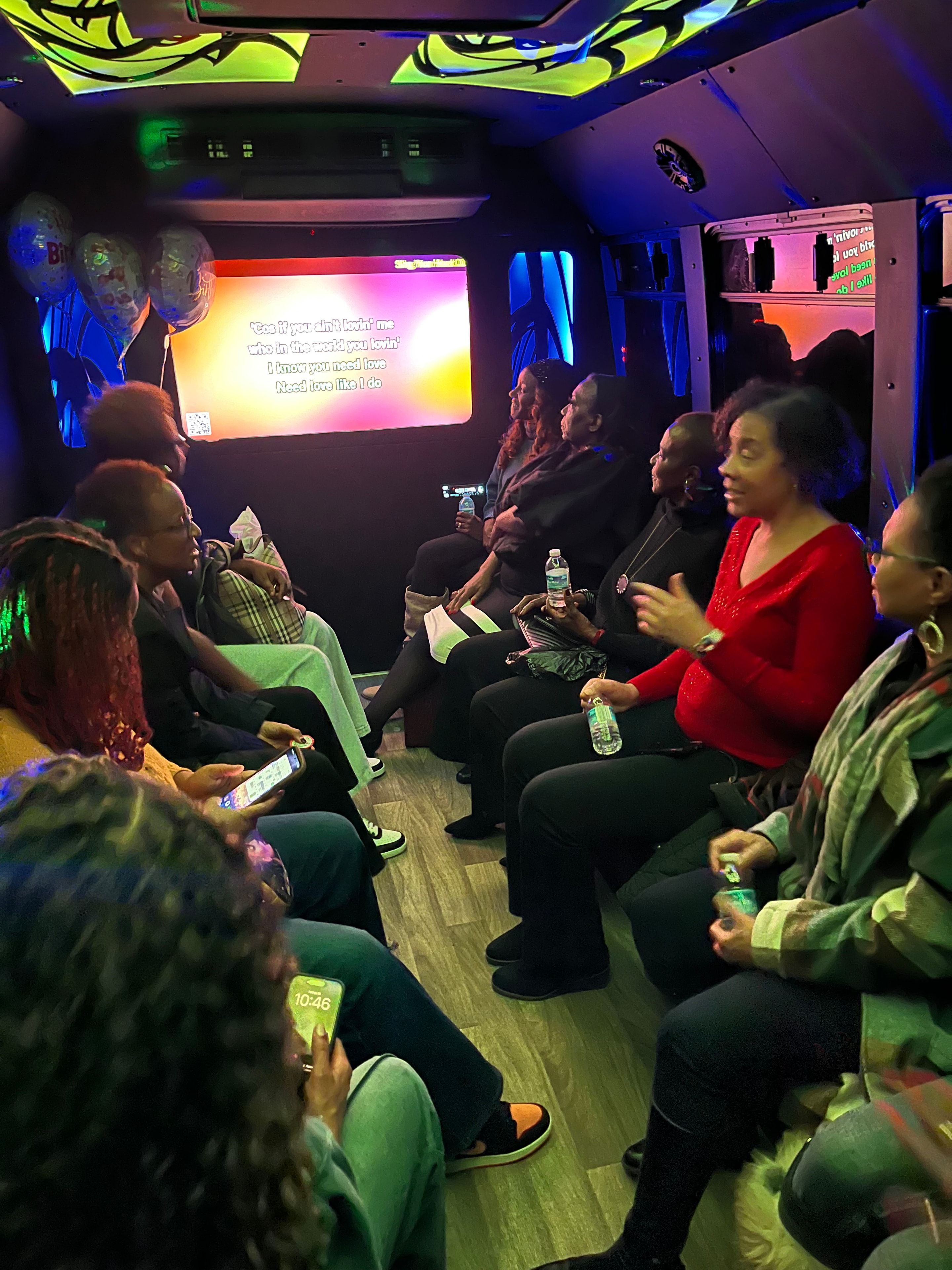 Group singing and dancing on the karaoke bus